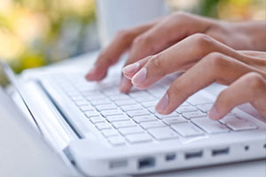 a laptop computer sitting on top of a keyboard