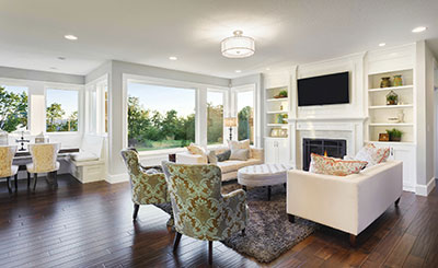 a living room filled with furniture and a fireplace